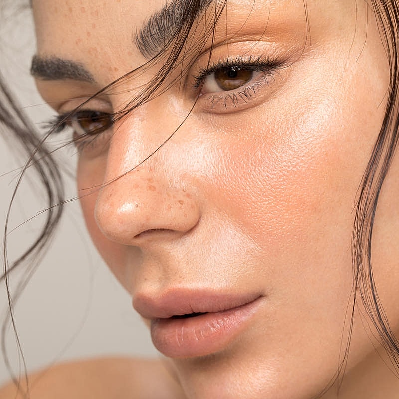 Close-up of a woman's face with natural beauty.