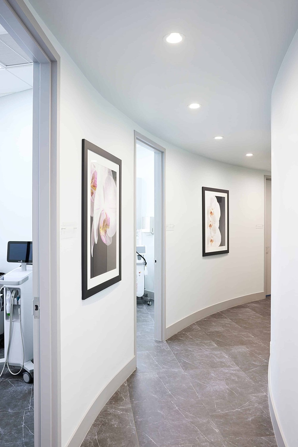 Modern hallway with artwork in medical facility.