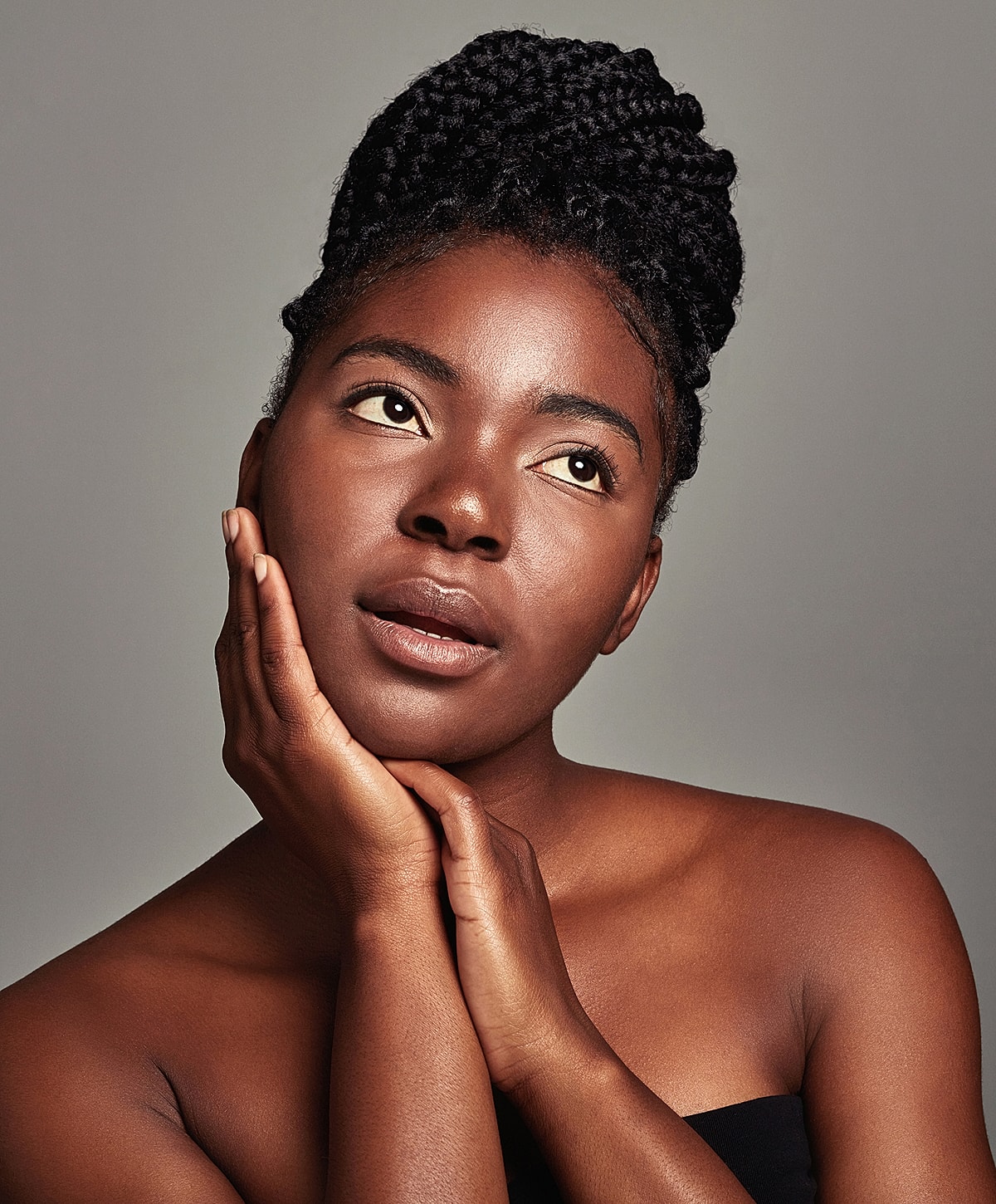 Doctor administering treatment to woman in clinic.