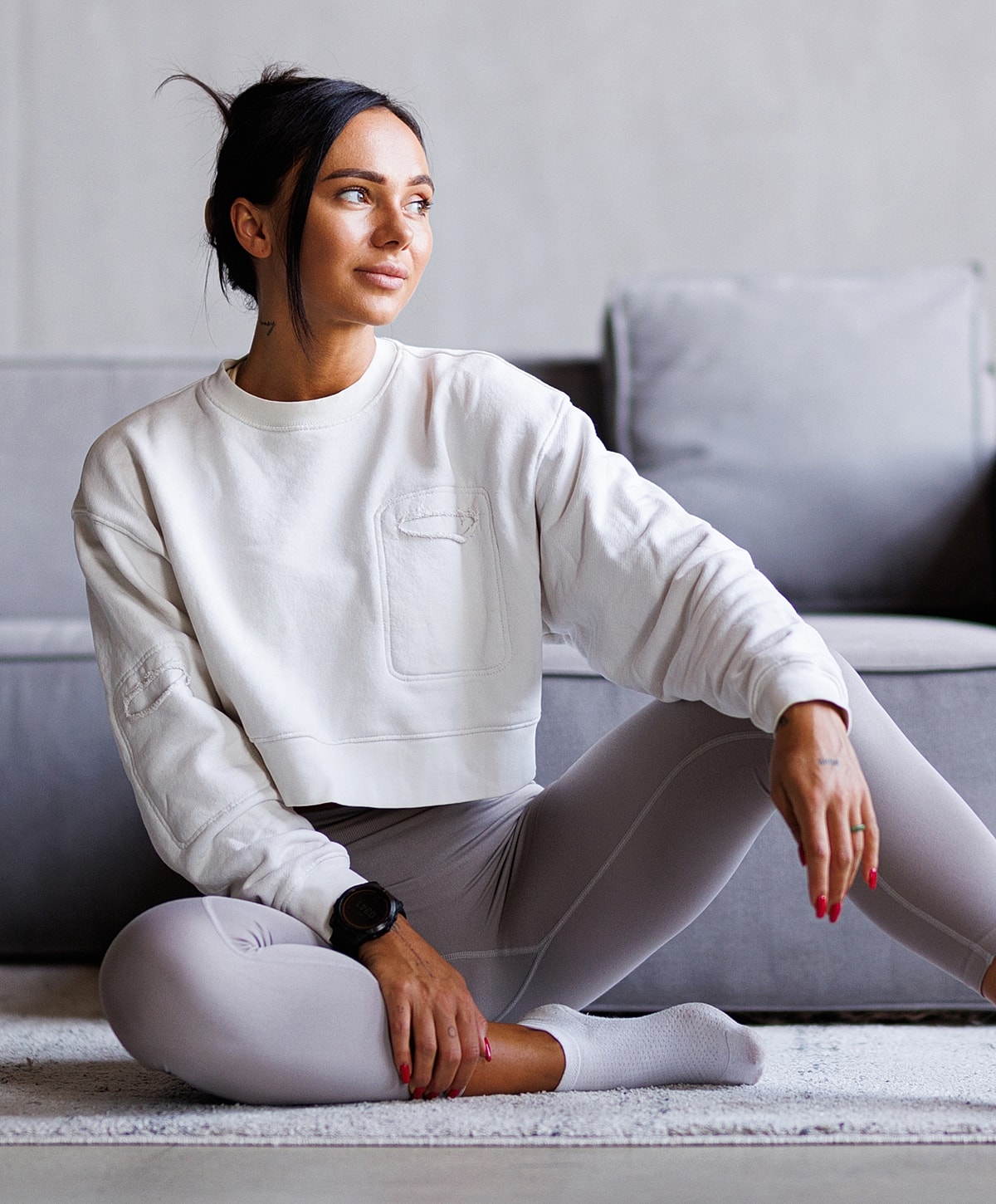 Woman with elegant hairstyle and white blouse.