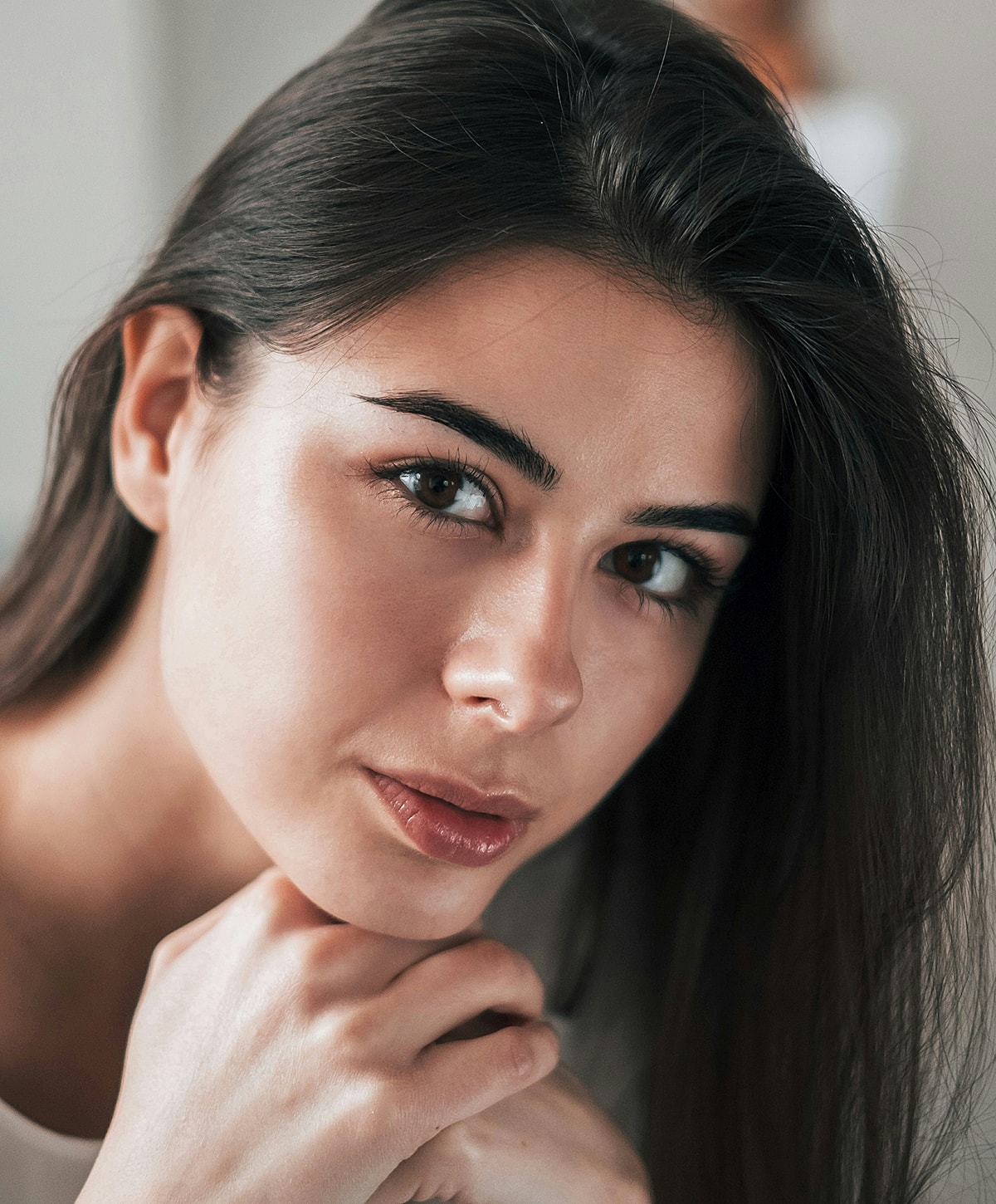 Doctor administering treatment to woman in clinic.