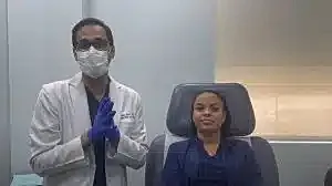 Patient and doctor in medical setting.