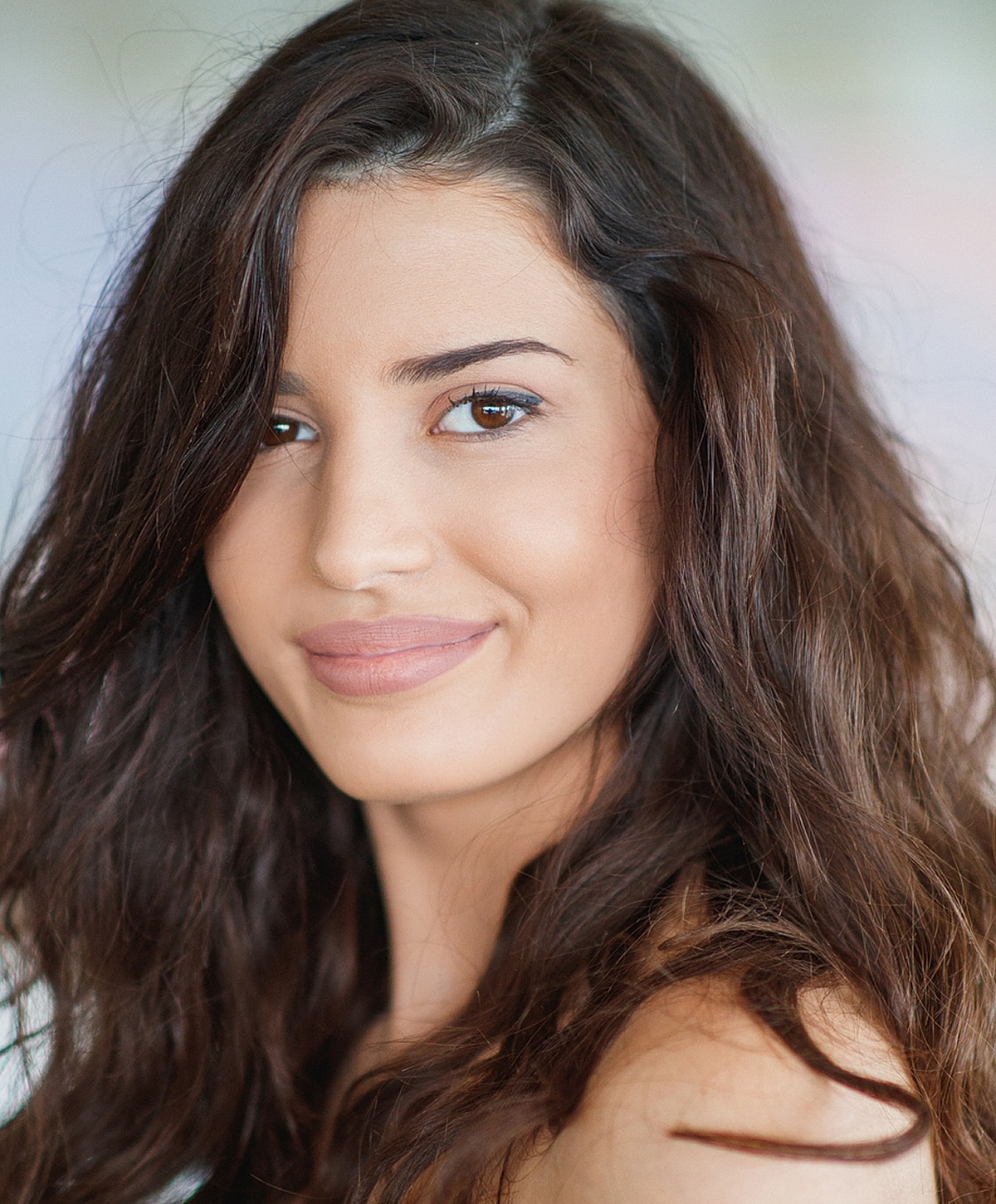 Doctor administering treatment to woman in clinic.