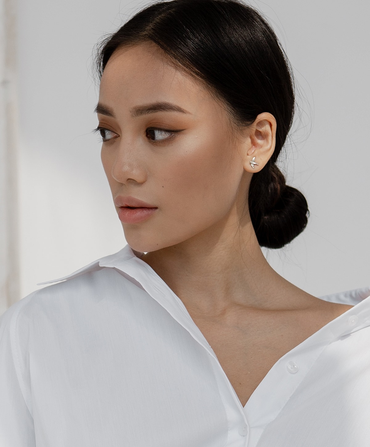 Doctor administering treatment to woman in clinic.