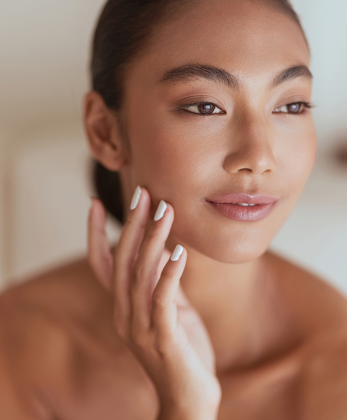 Doctor administering treatment to woman in clinic.