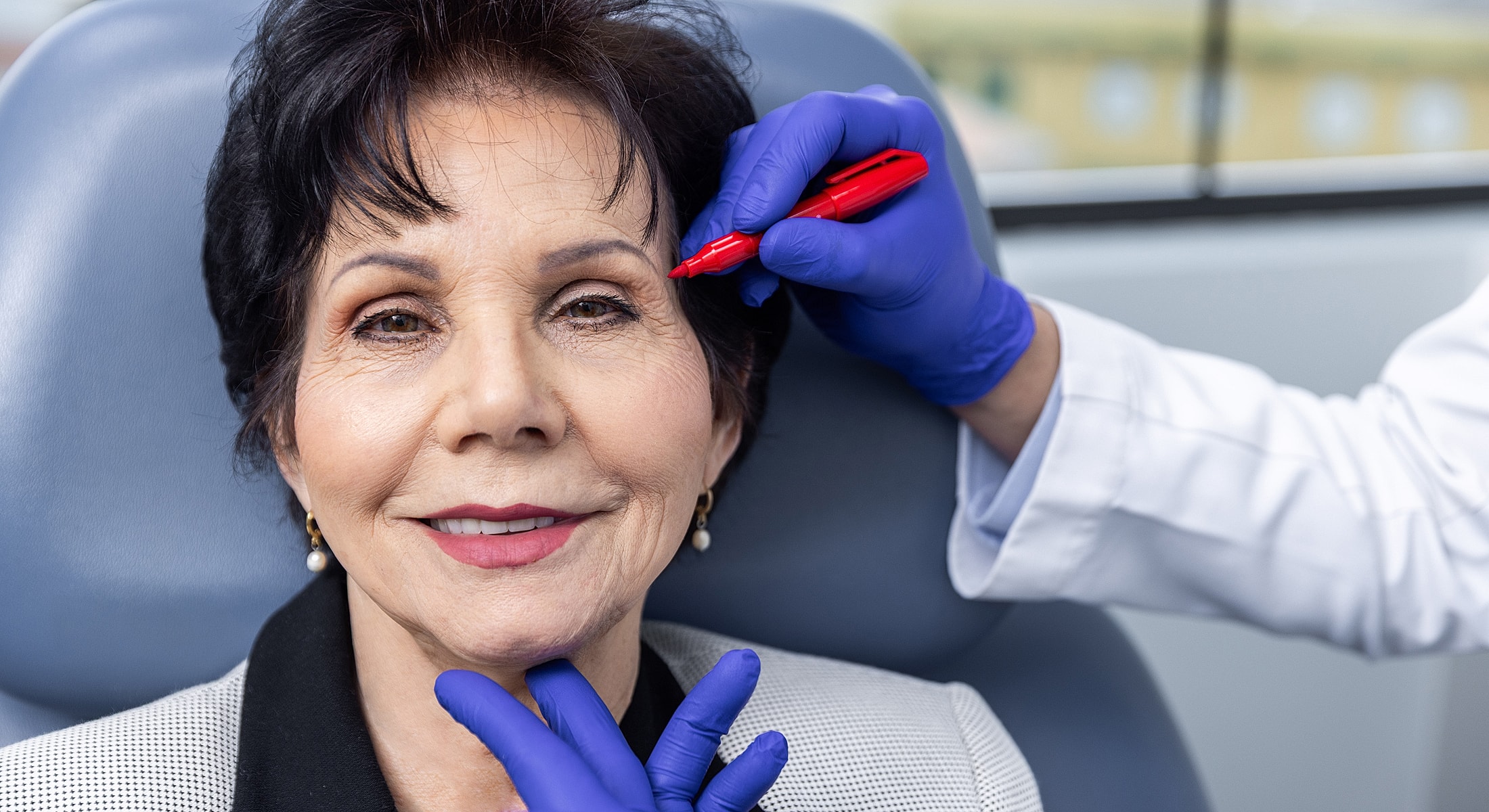 Patient consultation for cosmetic procedure in clinic.