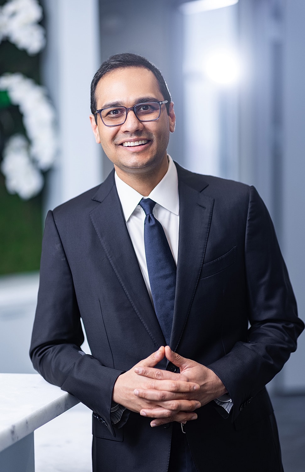Professional man smiling in a business suit.