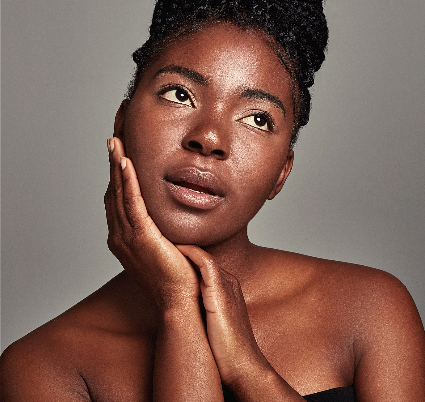 Portrait of a woman with braided hairstyle.