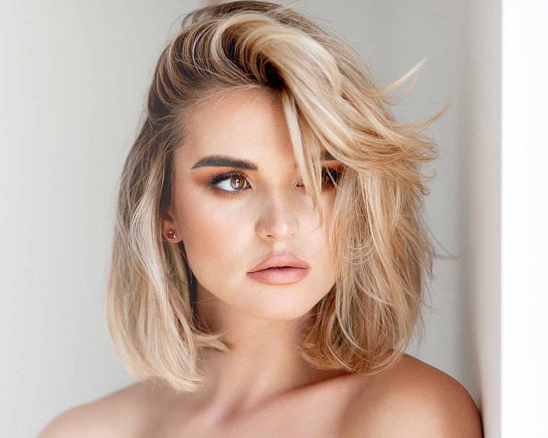 Portrait of a woman with blonde hair.