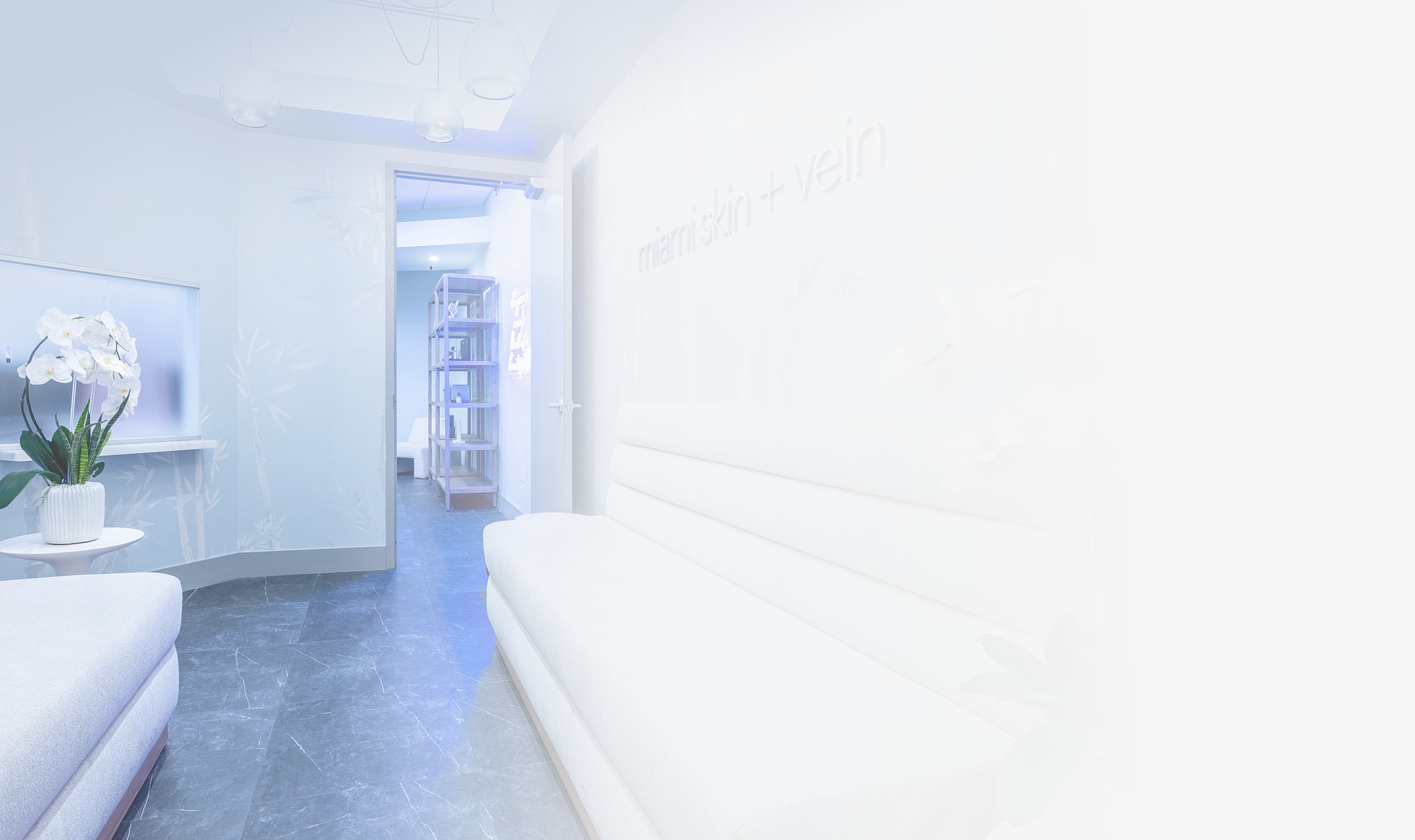 Modern medical office interior with soft furnishings.