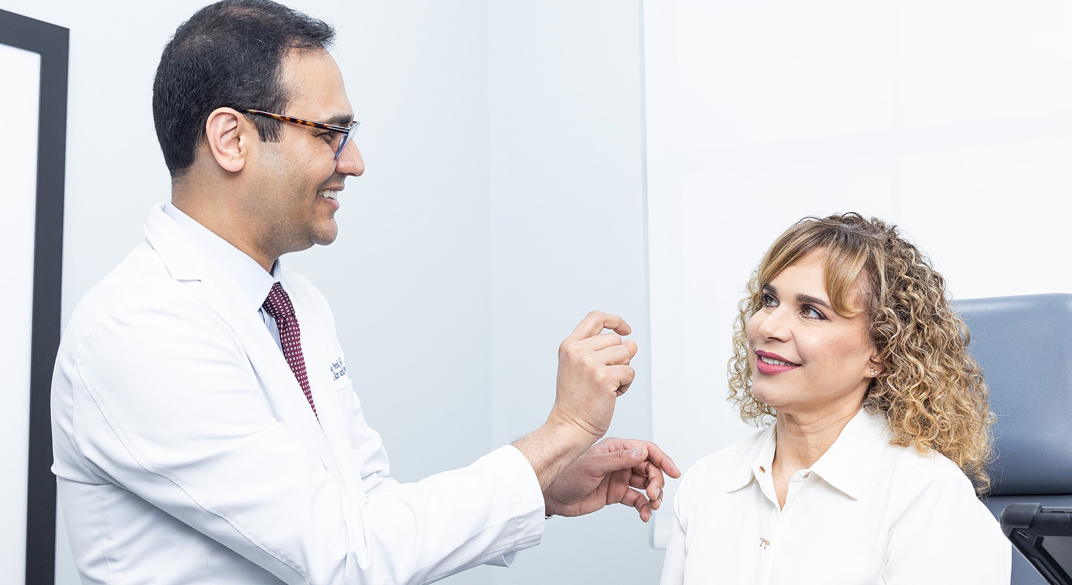 Doctor consulting with patient in clinic.